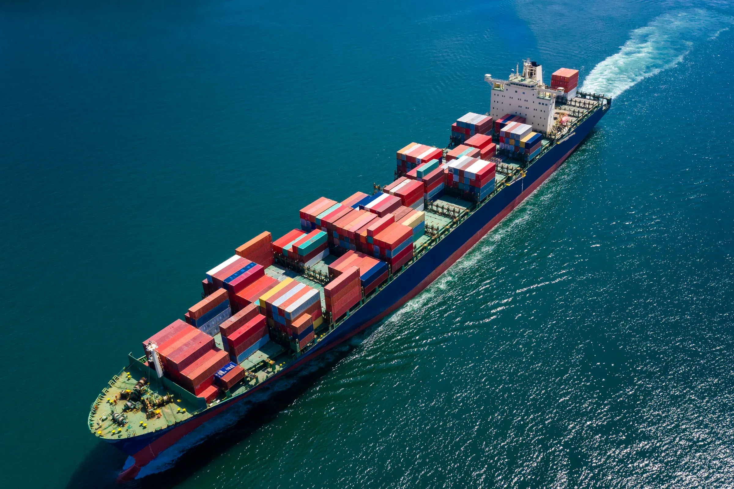 Aerial view of a loaded container ship under way