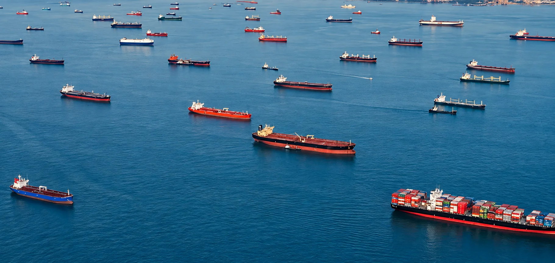 Ships at anchor on a blue sea, seen from above
